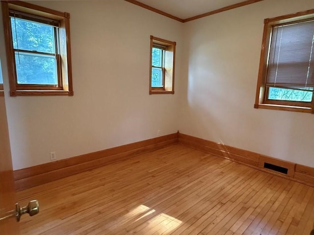 2999 18th St, Oak Grove Twp, WI 54868 - spare room with light wood finished floors and ornamental molding