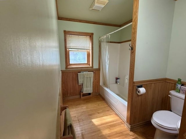 2999 18th St, Oak Grove Twp, WI 54868 - full bath featuring wainscoting, hardwood / wood-style floors, shower / bathtub combination with curtain, ornamental molding, and wood walls
