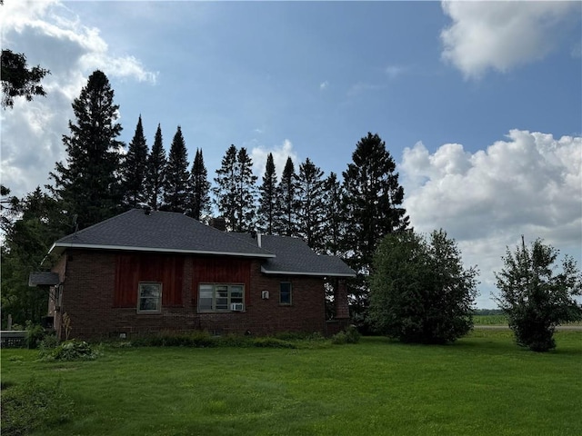 2999 18th St, Oak Grove Twp, WI 54868 - view of side of home featuring a lawn and brick siding