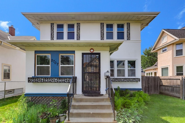 2707 Girard Ave N, Minneapolis, MN 55411 - american foursquare style home featuring stucco siding