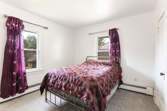 2707 Girard Ave N, Minneapolis, MN 55411 - carpeted bedroom with baseboard heating and multiple windows