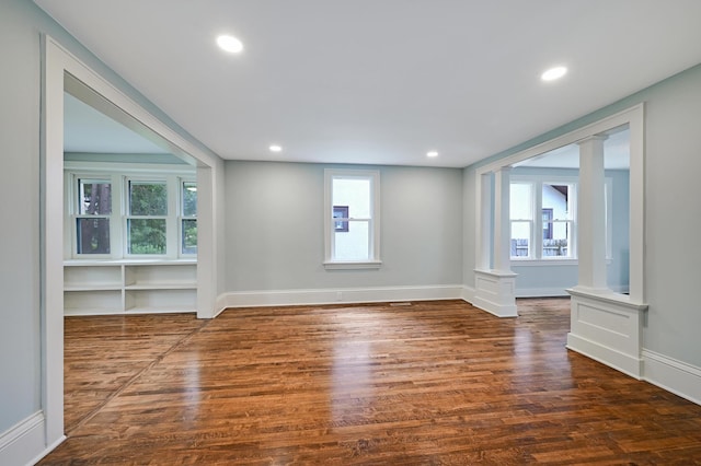 4416 46th Ave S, Minneapolis, MN 55406 - spare room with decorative columns, wood finished floors, plenty of natural light, and recessed lighting