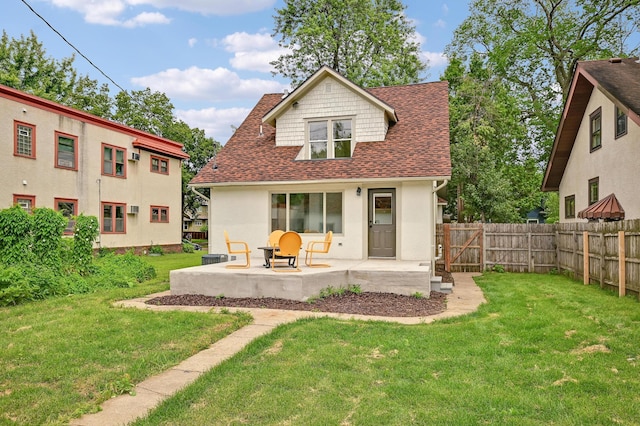 4416 46th Ave S, Minneapolis, MN 55406 - rear view of property featuring a patio area, roof with shingles, a fenced backyard, and stucco siding