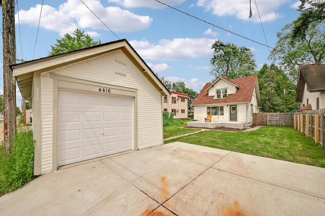 4416 46th Ave S, Minneapolis, MN 55406 - view of front facade featuring driveway, a detached garage, and an outdoor structure