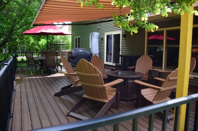 15620 45th Ave N, Plymouth, MN 55446 - deck with outdoor dining space, an outdoor fire pit, and grilling area