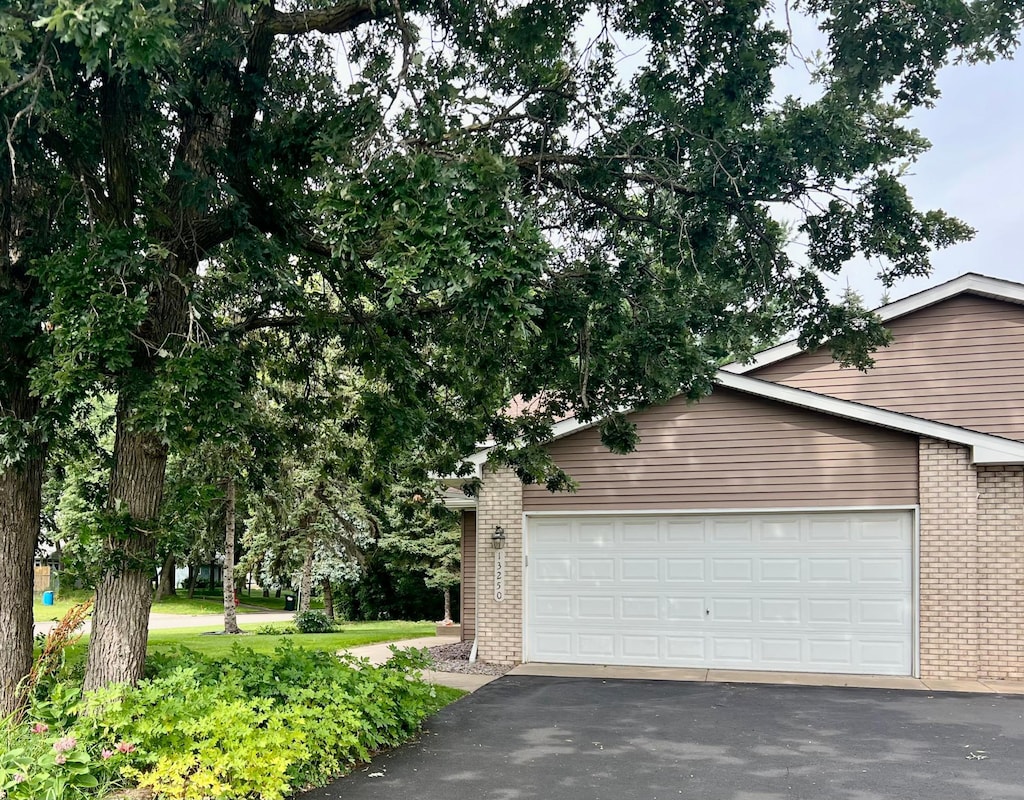 13250 Central Ave NE, Blaine, MN 55434 - garage with asphalt driveway