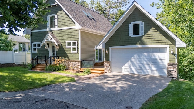 5108 Drummond Rd, Mound, MN 55364 - craftsman-style home with stone siding, concrete driveway, and an outbuilding