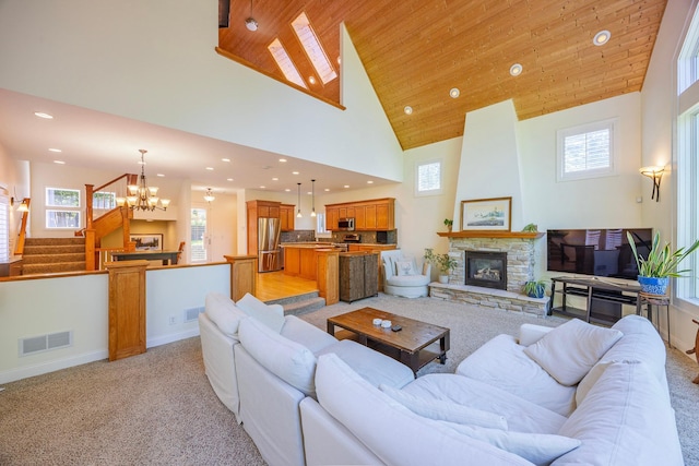 5108 Drummond Rd, Mound, MN 55364 - living room featuring wood ceiling, a chandelier, light colored carpet, recessed lighting, and stairway