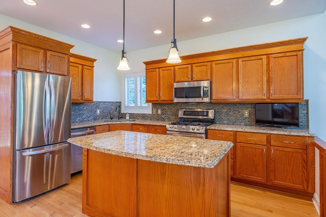 5108 Drummond Rd, Mound, MN 55364 - kitchen with appliances with stainless steel finishes, light wood-style floors, brown cabinets, and recessed lighting