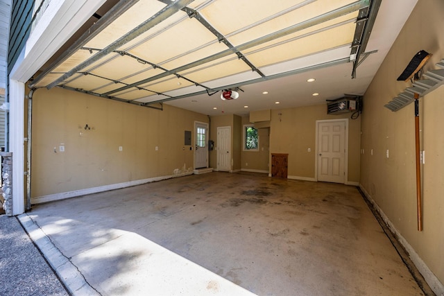 5108 Drummond Rd, Mound, MN 55364 - garage featuring a garage door opener and recessed lighting