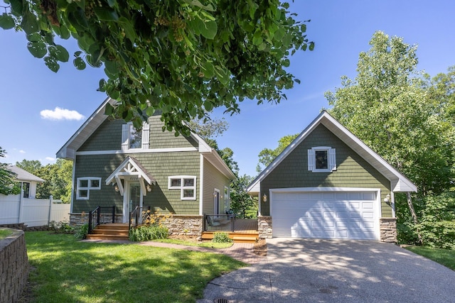 5108 Drummond Rd, Mound, MN 55364 - view of front of property with stone siding and a garage