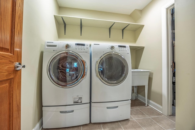 5108 Drummond Rd, Mound, MN 55364 - washroom featuring washer and dryer and light tile patterned flooring