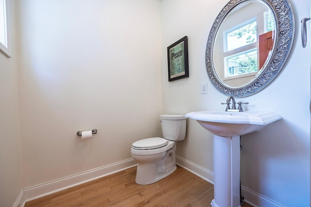 5108 Drummond Rd, Mound, MN 55364 - half bathroom featuring baseboards and wood finished floors