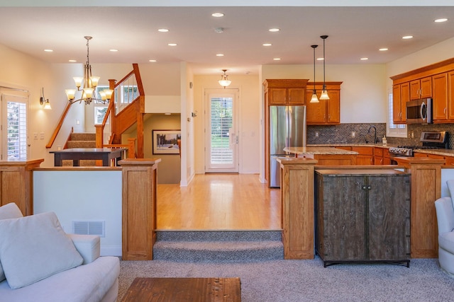 5108 Drummond Rd, Mound, MN 55364 - kitchen with stainless steel appliances, healthy amount of natural light, open floor plan, a center island, and recessed lighting