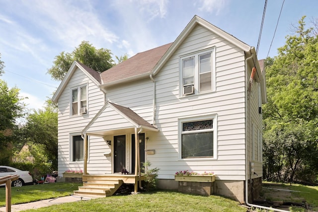 129 Morton St E, Saint Paul, MN 55107 - bungalow with a front lawn, roof with shingles, and cooling unit