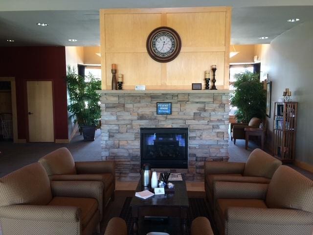 4964 Emmit Dr N Unit 3, Hugo, MN 55038 - living room featuring baseboards and an outdoor stone fireplace