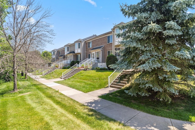 4964 Emmit Dr N Unit 3, Hugo, MN 55038 - view of community featuring stairway, a residential view, and a yard
