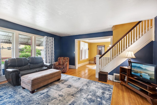 818 7th St S, Stillwater, MN 55082 - living room featuring stairway and wood finished floors