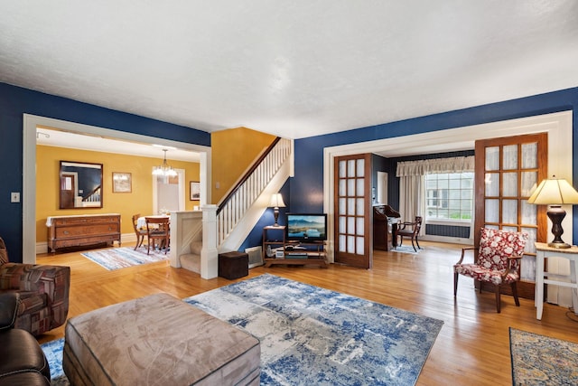 818 7th St S, Stillwater, MN 55082 - living room with a chandelier, wood finished floors, and stairway