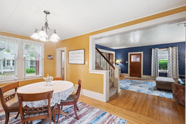 818 7th St S, Stillwater, MN 55082 - dining room with a chandelier, wood-type flooring, and stairway