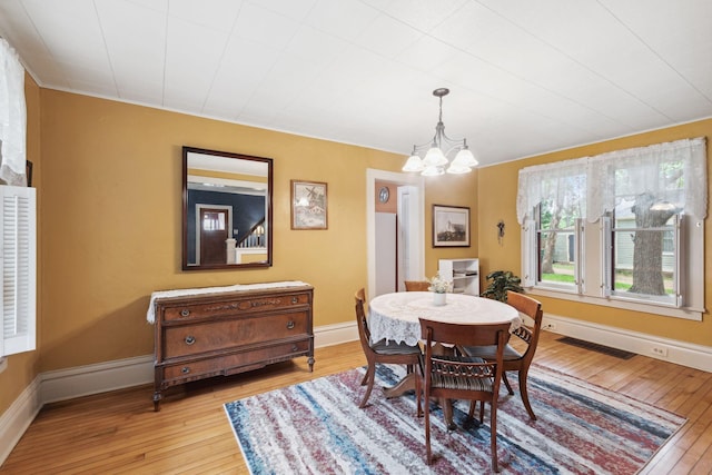818 7th St S, Stillwater, MN 55082 - dining room with hardwood / wood-style floors and a chandelier
