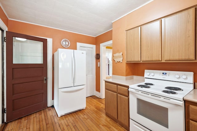 818 7th St S, Stillwater, MN 55082 - kitchen featuring white appliances, light wood-type flooring, light countertops, and crown molding