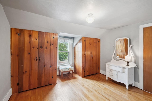 818 7th St S, Stillwater, MN 55082 - bedroom featuring light wood-style flooring and vaulted ceiling