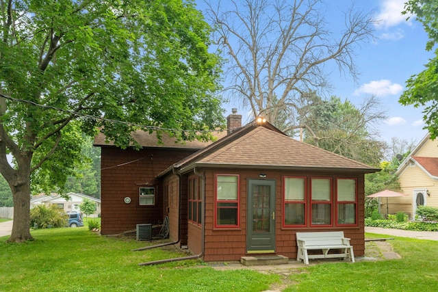 818 7th St S, Stillwater, MN 55082 - back of property featuring a chimney, a lawn, and a shingled roof