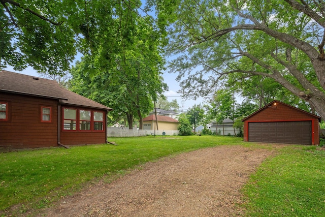 818 7th St S, Stillwater, MN 55082 - view of yard with a detached garage and an outdoor structure