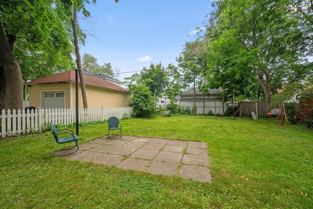 818 7th St S, Stillwater, MN 55082 - fenced backyard with a patio, a garage, and an outbuilding