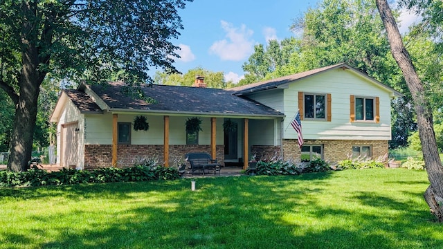 19720 Jackie Ln, Corcoran, MN 55374 - split level home with brick siding, a front yard, a chimney, and covered porch
