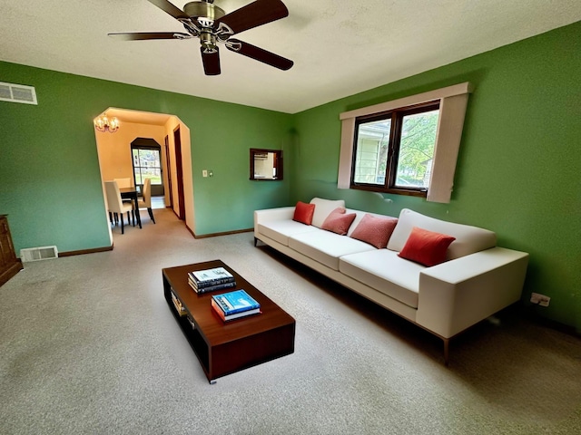 7520 14th Ave S, Richfield, MN 55423 - living area with arched walkways, carpet flooring, and ceiling fan