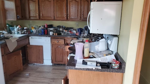 48 Buffalo St, Duluth, MN 55811 - kitchen with dishwasher, light wood finished floors, and brown cabinetry