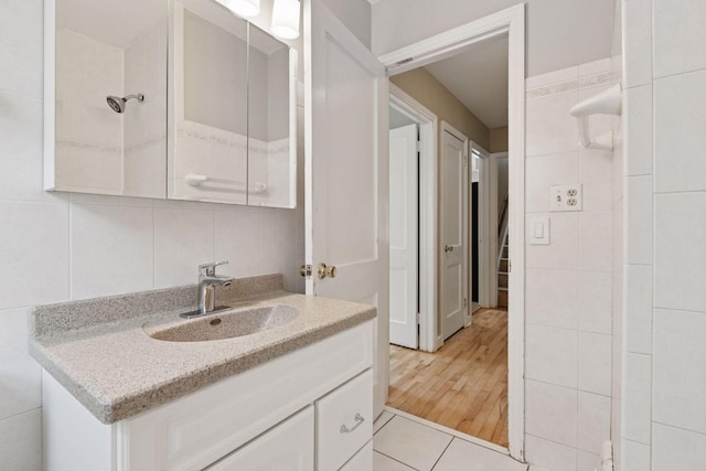 3137 Hampshire Ave S, Saint Louis Park, MN 55426 - bathroom featuring tile walls and vanity
