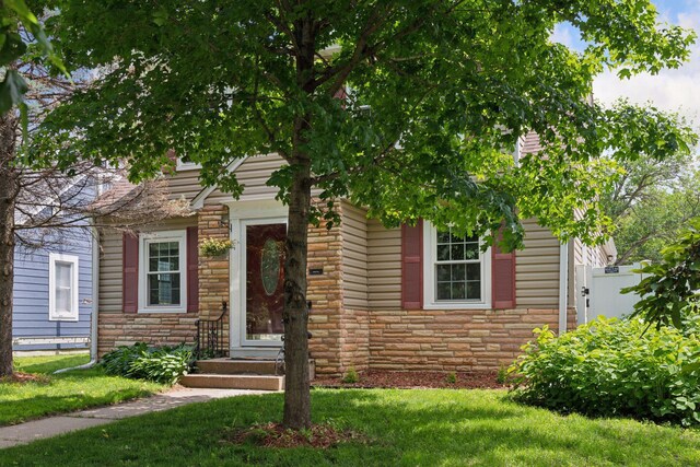 3137 Hampshire Ave S, Saint Louis Park, MN 55426 - view of front of house featuring stone siding and a front lawn