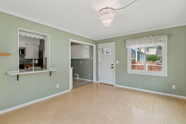 3137 Hampshire Ave S, Saint Louis Park, MN 55426 - entrance foyer with crown molding, wood finished floors, and a chandelier