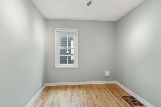 3137 Hampshire Ave S, Saint Louis Park, MN 55426 - spare room with wood-type flooring and baseboards