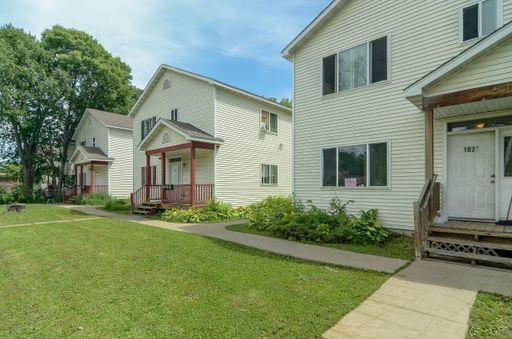 1028 Knox Ave N, Minneapolis, MN 55411 - view of front of house with a front lawn and covered porch