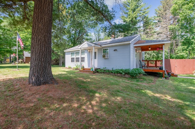 11711 County Rd, B, Lake Nebagamon, WI 54849 - view of front of home featuring a front lawn, cooling unit, and roof with shingles