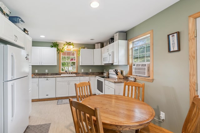 11711 County Rd, B, Lake Nebagamon, WI 54849 - kitchen with white appliances, cooling unit, white cabinets, recessed lighting, and dark stone counters