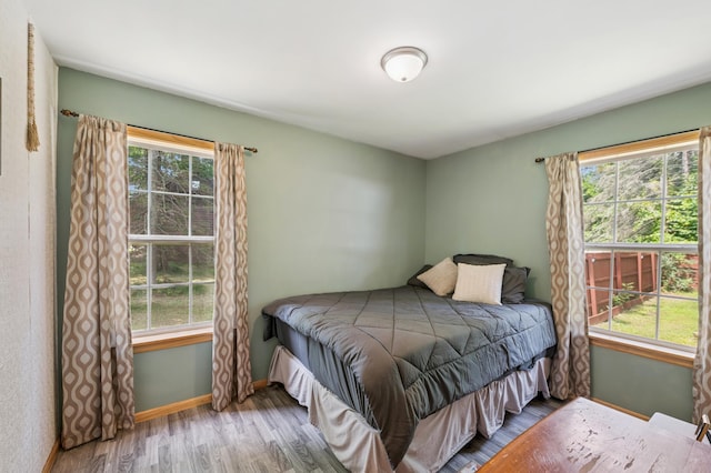 11711 County Rd, B, Lake Nebagamon, WI 54849 - bedroom featuring wood finished floors and baseboards