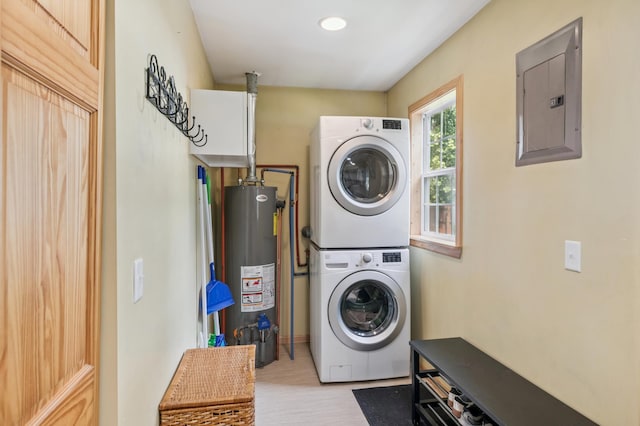 11711 County Rd, B, Lake Nebagamon, WI 54849 - washroom featuring electric panel, stacked washing machine and dryer, and gas water heater