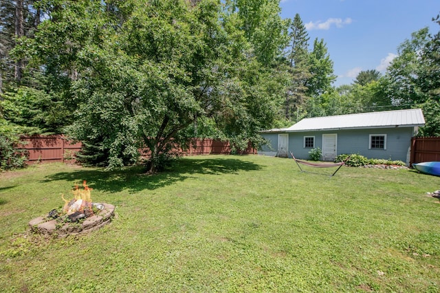 11711 County Rd, B, Lake Nebagamon, WI 54849 - fenced backyard featuring an outdoor fire pit