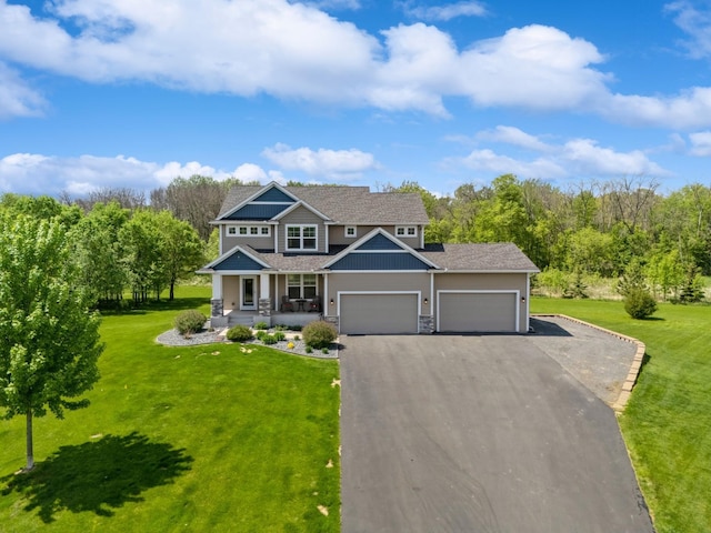 24000 Helium Ct, Forest Lake, MN 55025 - craftsman inspired home with a porch, asphalt driveway, a garage, a front lawn, and stone siding