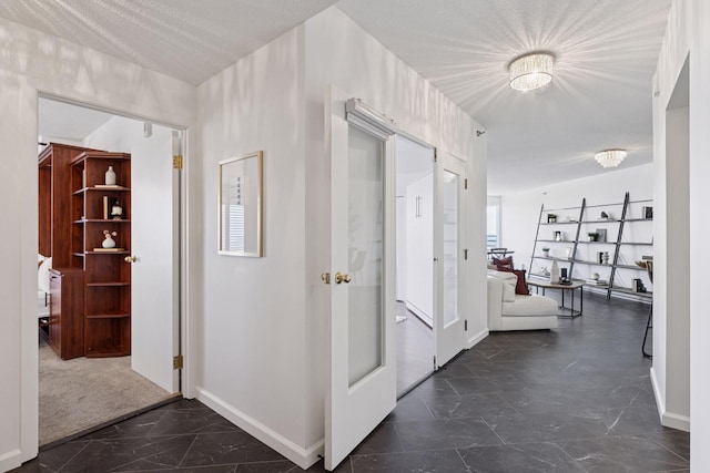 168 6th St E Unit 3004, Saint Paul, MN 55101 - hallway featuring dark marble finish flooring and baseboards