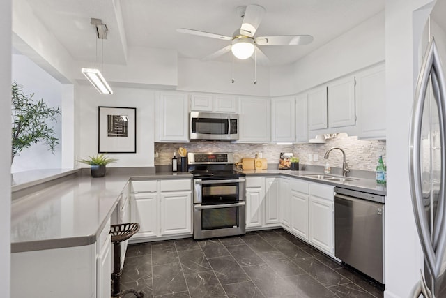 168 6th St E Unit 3004, Saint Paul, MN 55101 - kitchen featuring appliances with stainless steel finishes, white cabinetry, dark marble finish flooring, and tasteful backsplash