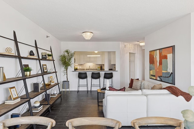 168 6th St E Unit 3004, Saint Paul, MN 55101 - living room featuring a textured ceiling