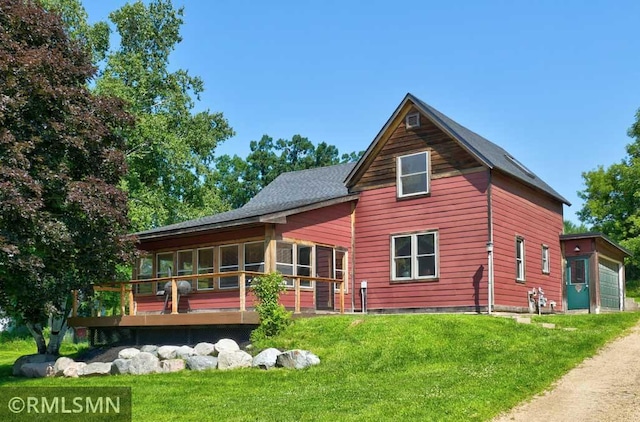 1217 83rd Ave, Lincoln Twp, WI 54001 - back of property with a sunroom, a yard, and a garage