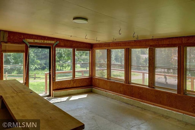 1217 83rd Ave, Lincoln Twp, WI 54001 - unfurnished sunroom featuring plenty of natural light and wood walls