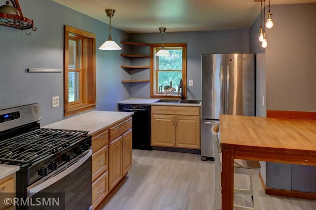 1217 83rd Ave, Lincoln Twp, WI 54001 - kitchen featuring stainless steel appliances, open shelves, light wood-type flooring, decorative light fixtures, and light brown cabinetry